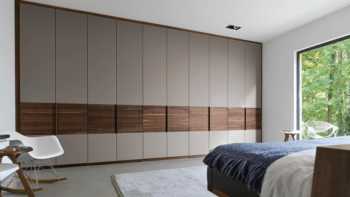 hinge door wardrobe in walnut with wooden band relief and coloured glass fronts valore hinged door wardrobe in walnut with elegant wooden band in relief and coloured glass fronts