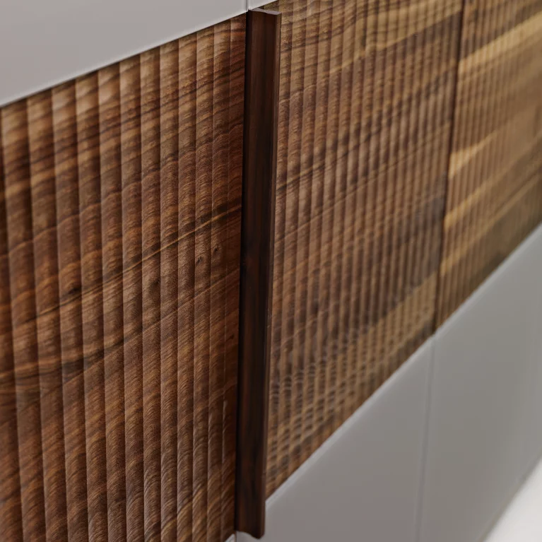 hinge door wardrobe wooden band relief made of wood with coloured glass fronts, detailed view valore hinge door wardrobe wooden band relief in walnut with coloured glass fronts, detailed view