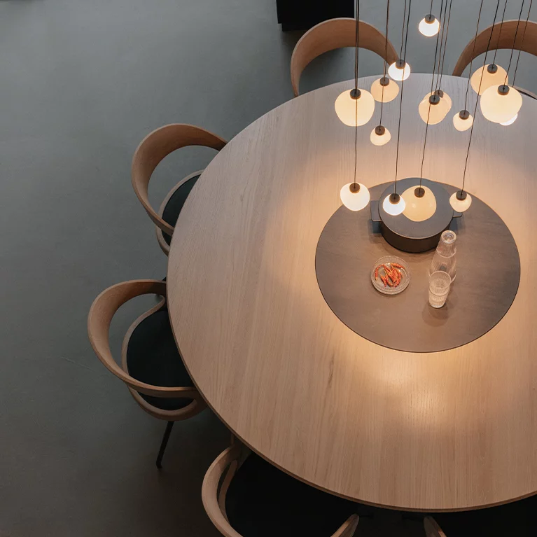 round dining table made of solid wood with comfortable girado chairs miró round dining table made of solid wood in oak white oil with integrated turntable and comfortable girado chairs