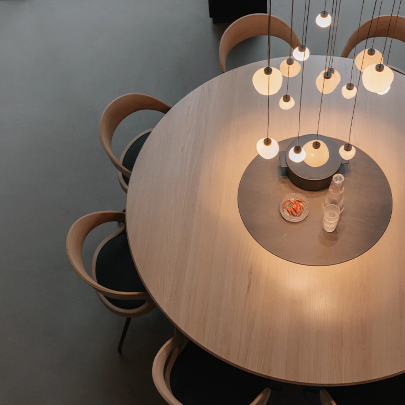 round dining table made of solid wood with comfortable girado chairs miró round dining table made of solid wood in oak white oil with integrated turntable and comfortable girado chairs