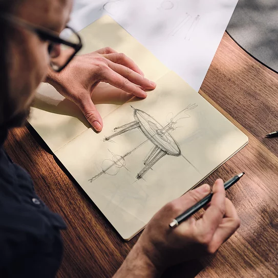 Hand sketch by TEAM 7 designer when designing miró tables