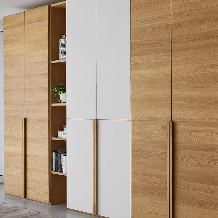 hinge-door wardrobe in solid oak with angled handles lunetto hinge-door wardrobe in oak with elegant angled handles and coloured glass fronts
